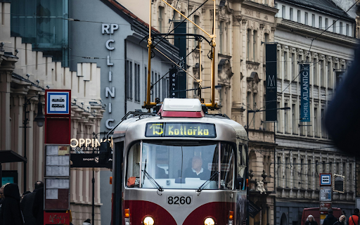 A red and white tram on a city street from Chrome web store to be run with OffiDocs Chromium online A red and white tram on a city street from Chrome web store to be run with OffiDocs Chromium online
