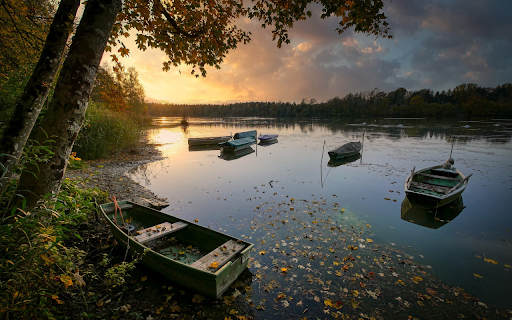Boat docked on the river from Chrome web store to be run with OffiDocs Chromium online Boat docked on the river from Chrome web store to be run with OffiDocs Chromium online