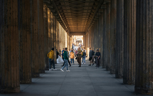 People walking through a long hallway with columns from Chrome web store to be run with OffiDocs Chromium online People walking through a long hallway with columns from Chrome web store to be run with OffiDocs Chromium online