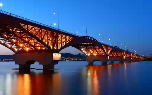 Illuminated Bridge Spanning a Tranquil River at Dusk from Chrome web store to be run with OffiDocs Chromium online Illuminated Bridge Spanning a Tranquil River at Dusk from Chrome web store to be run with OffiDocs Chromium online