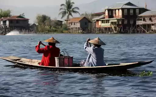 Two people rowing a boat by the river from Chrome web store to be run with OffiDocs Chromium online Two people rowing a boat by the river from Chrome web store to be run with OffiDocs Chromium online
